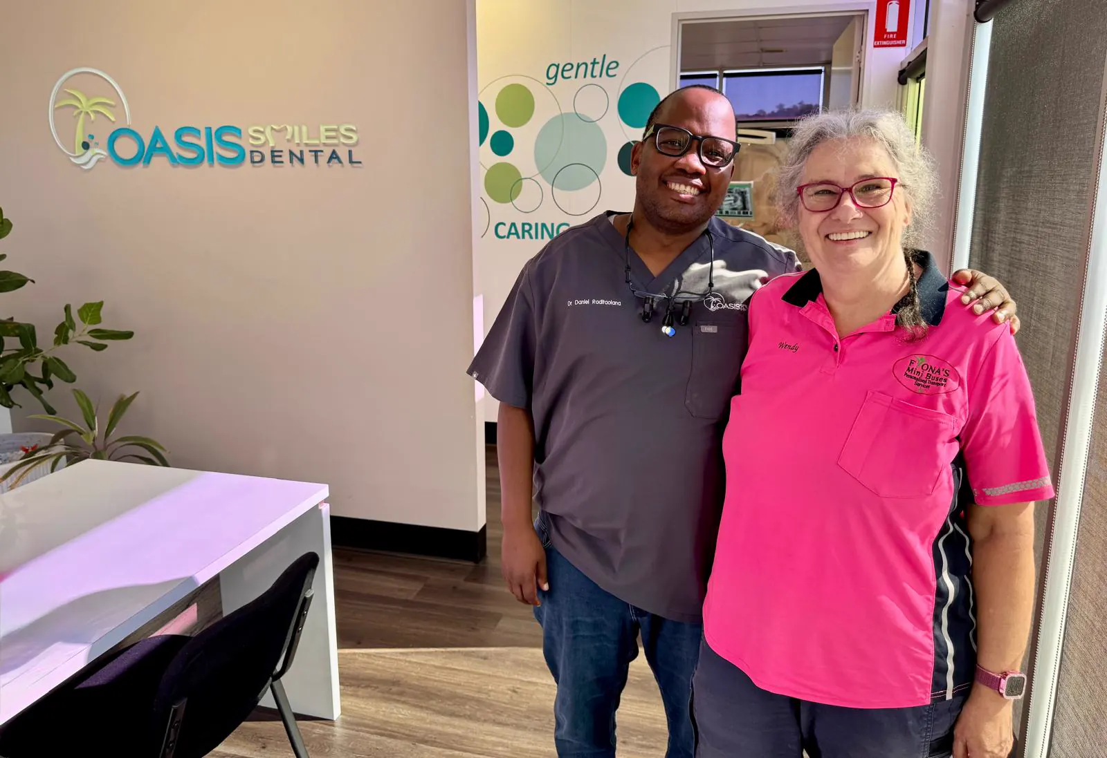 Dr Daniel with a patient at Oasis Smiles Dental