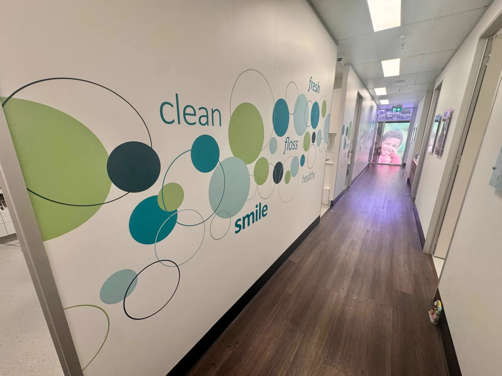 Oasis Smiles Dental hallway with welcoming wall art