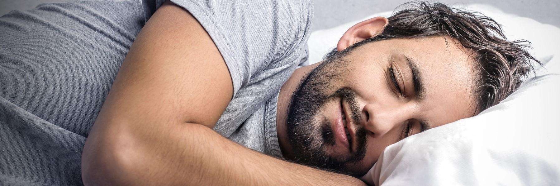 A man sleeps comfortably, emphasizingthe benefits of sleep management services