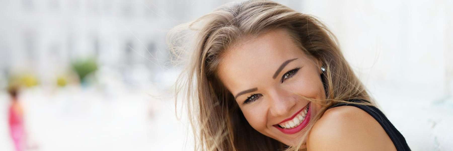 A woman with straight teeth smiling | dentist near Bendemeer
