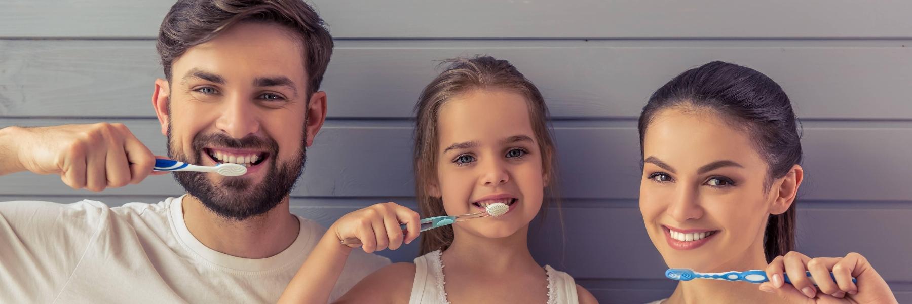 Family brushing teeth in Tamworth