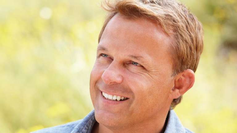 A man smiling in a field | Tamworth dentist