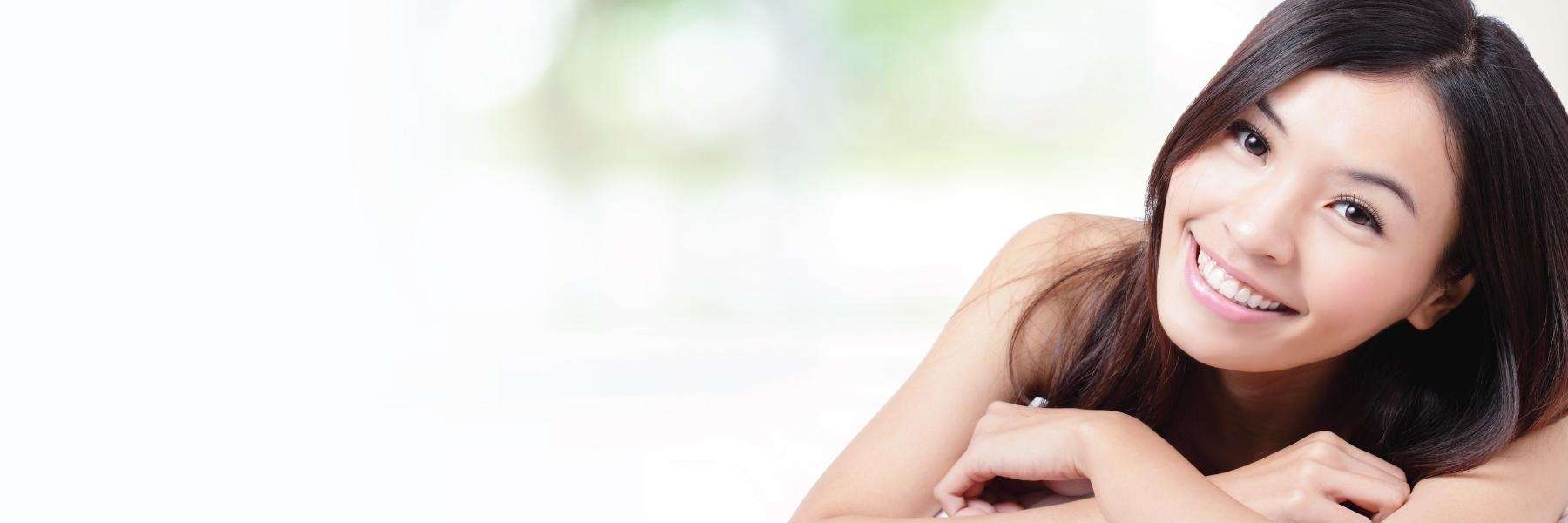 Woman smiling confidently after treatment by a top cosmetic dentist in Tamworth