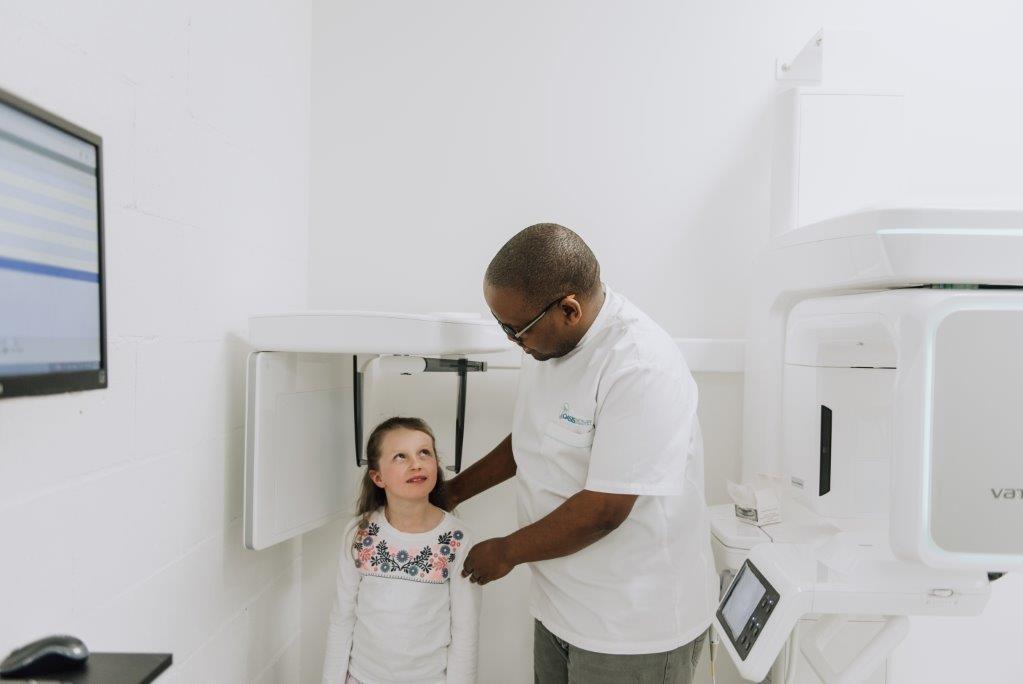 Our Family Friendly Practice Dr. Raditaolana and young patient at Oasis Smiles Dental